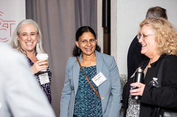 Attendees chat during a networking break.